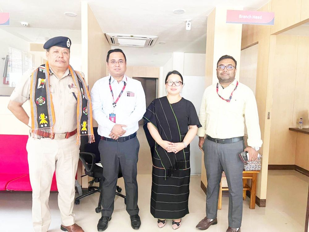 Commissioner of Police, Dimapur, Kevithuto Sophie along with the staffs of Bandhan bank during the opening of its second branch in Dimapur on May 30. (Morung Photo)